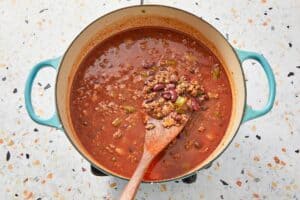 Stirring the beans with the broth and beef