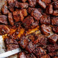 Top view image of Tender pan seared Cajun Butter Steak Bites are full flavored with crispy edges in a pan