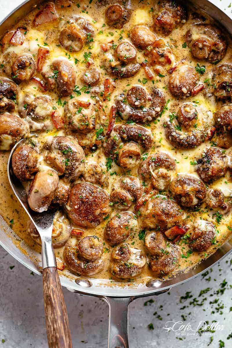 Creamy Garlic Mushrooms in a mouthwatering parmesan sauce with crispy bacon pieces and mozzarella cheese! Low carb and Keto approved! | cafedelites.com