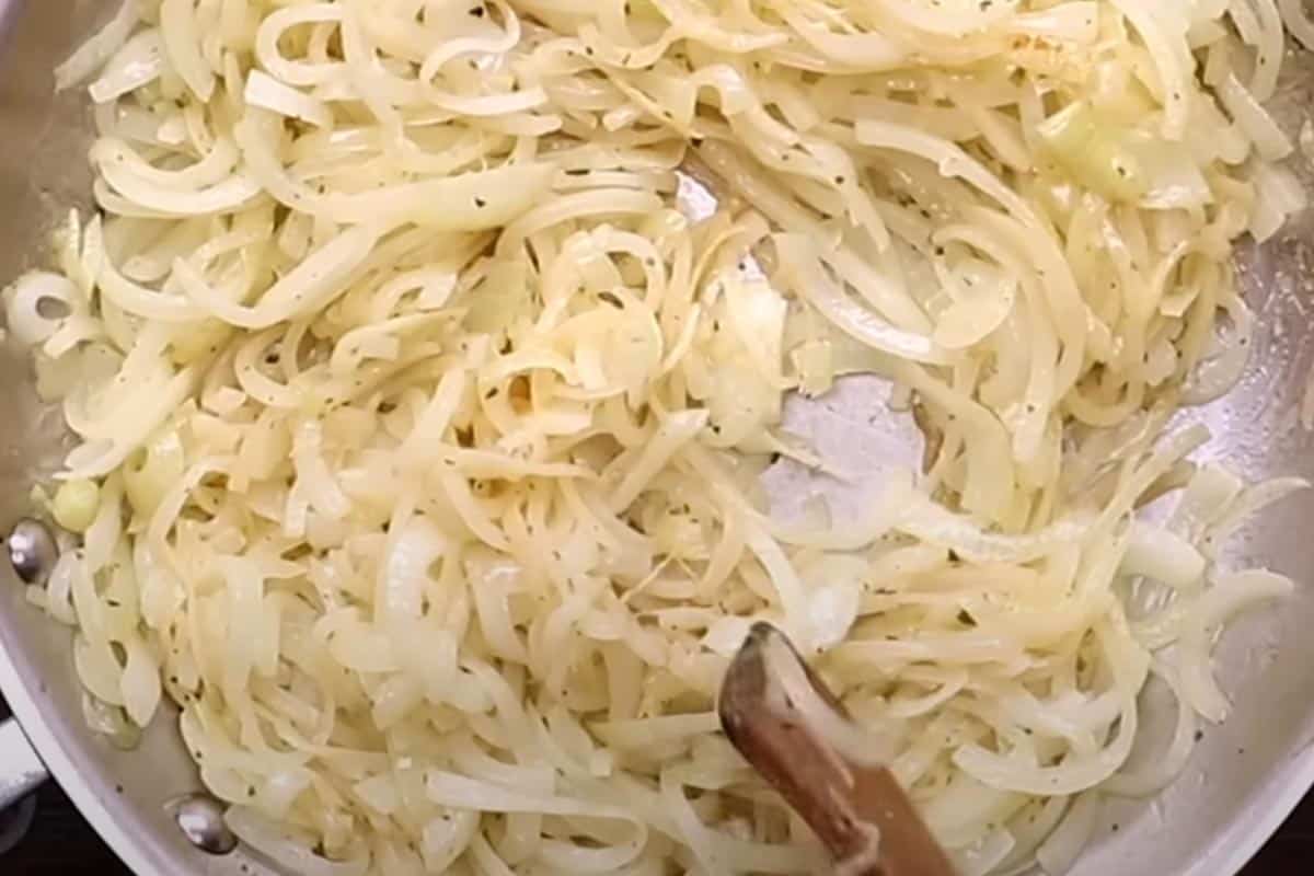 Cooking the onions in a pan.