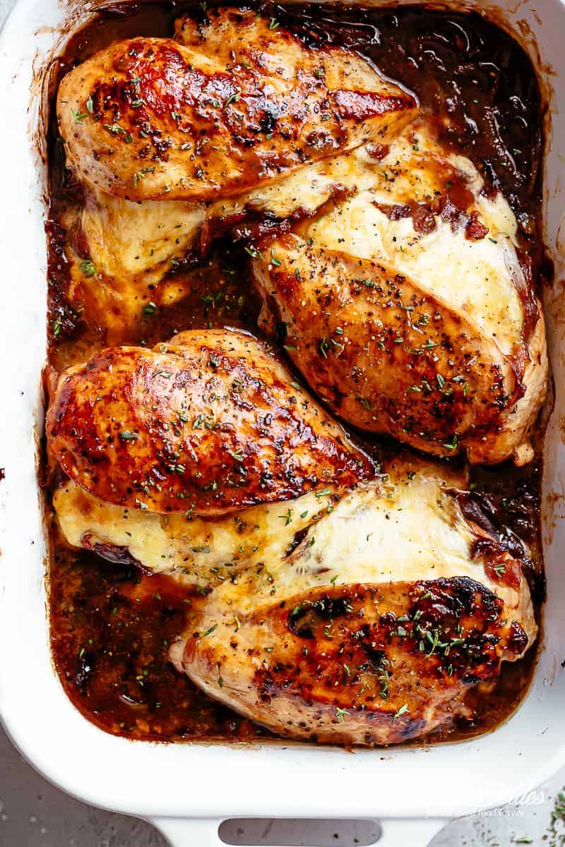 French Onion Stuffed Chicken Casserole makes for a delicious dinner! Juicy, succulent chicken breasts stuffed with caramelized onions and glorious melted cheese. | cafedelites.com