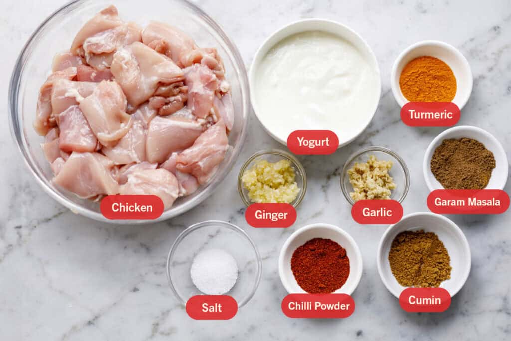 Ingredients labelled on each item viz chicken, yogurt, ginger, tumeric, garlic, yogurt, garam masala, salt, chilli powder, cumin