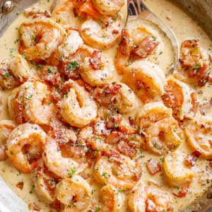 Carbonara Bacon Shrimp Alfredo in a bowl with spoon