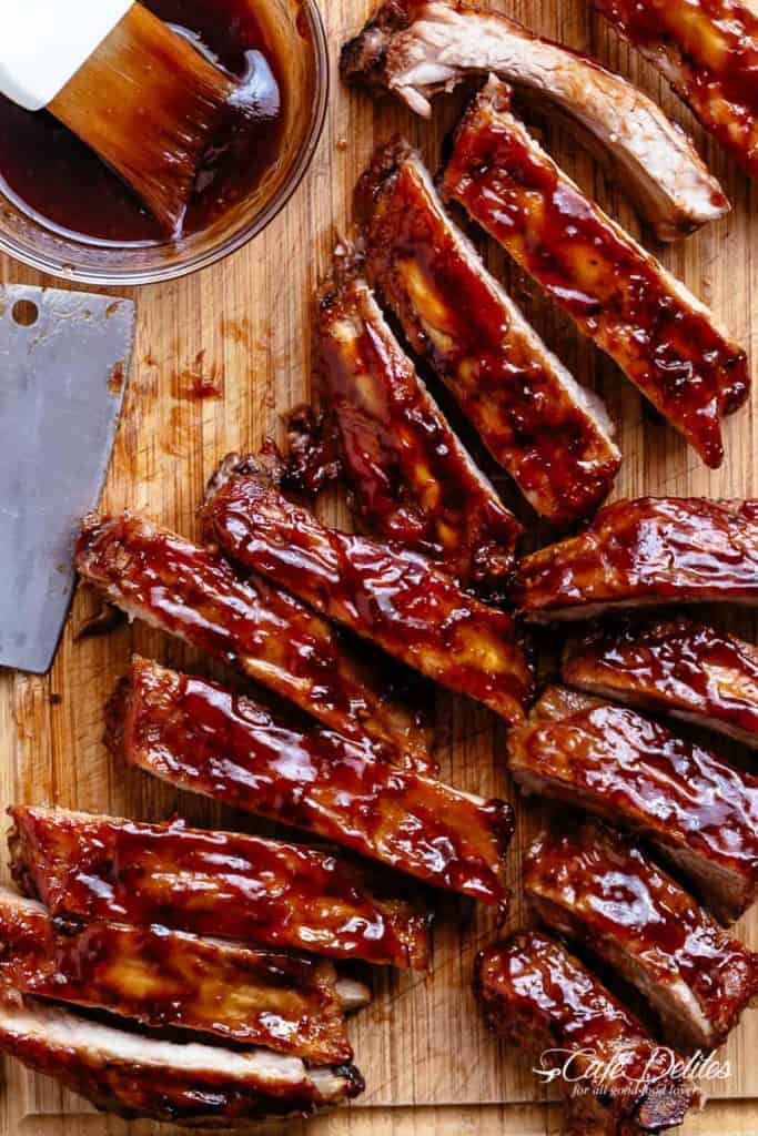 Slow cooker ribs slathered in the most delicious sticky barbecue sauce with a kick of garlic and optional heat! Juicy melt-in-your-mouth oven baked Barbecue Pork Ribs are fall-off-the-bone delicious! Double up on incredible flavour with an easy to make dry rub first, then coat them in a seasoned barbecue sauce mixture so addictive you won't stop at one! Finger licking good ribs right here! | cafedelites.com