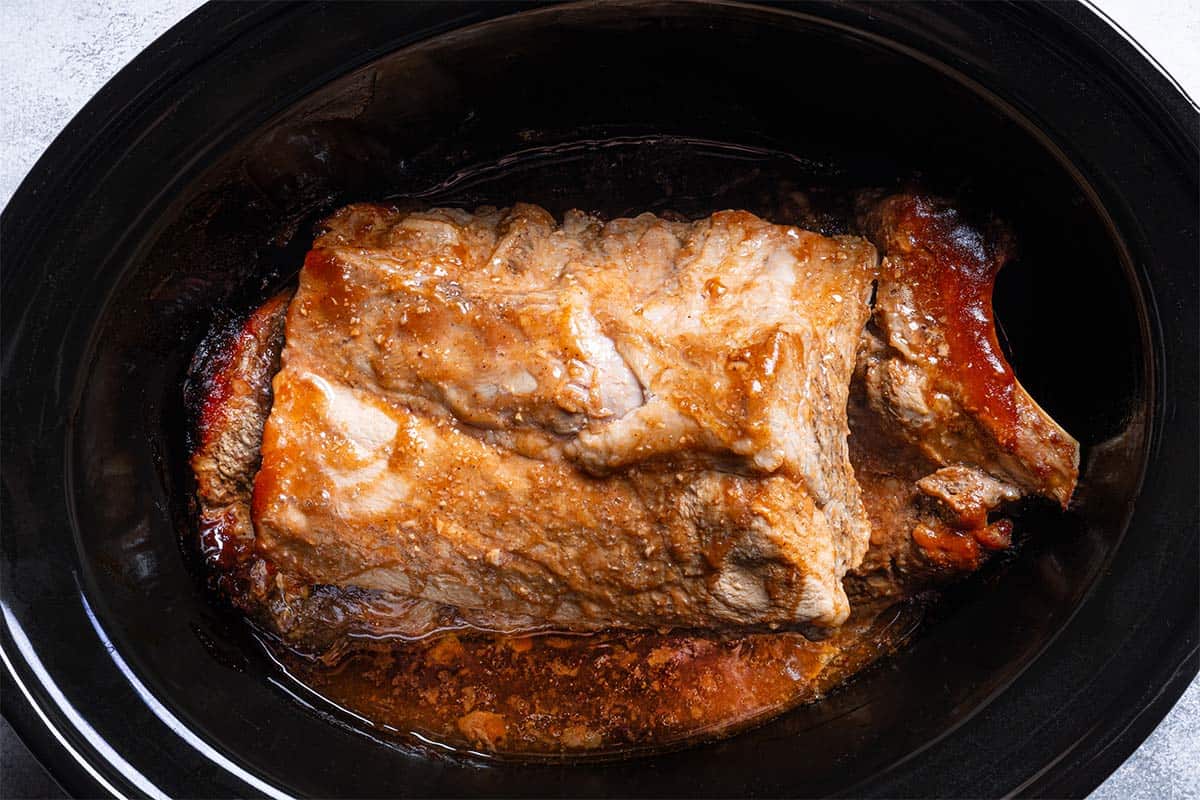 very juicy cooked baby back ribs in the slow cooker 