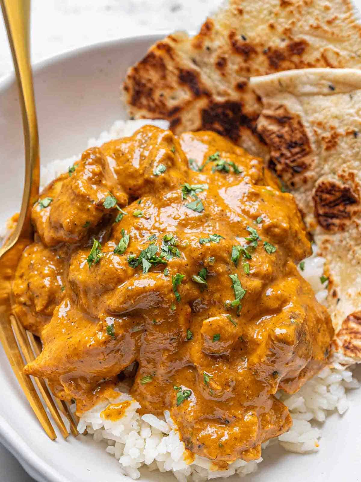 Butter Chicken (Murgh Makhani) with tandoori roti and rice