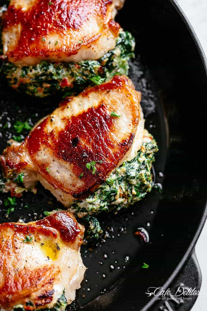 Creamed Spinach Stuffed Pork Chops with sun dried tomatoes will have your mouthwatering before they hit the dinner table! | cafedelites.com