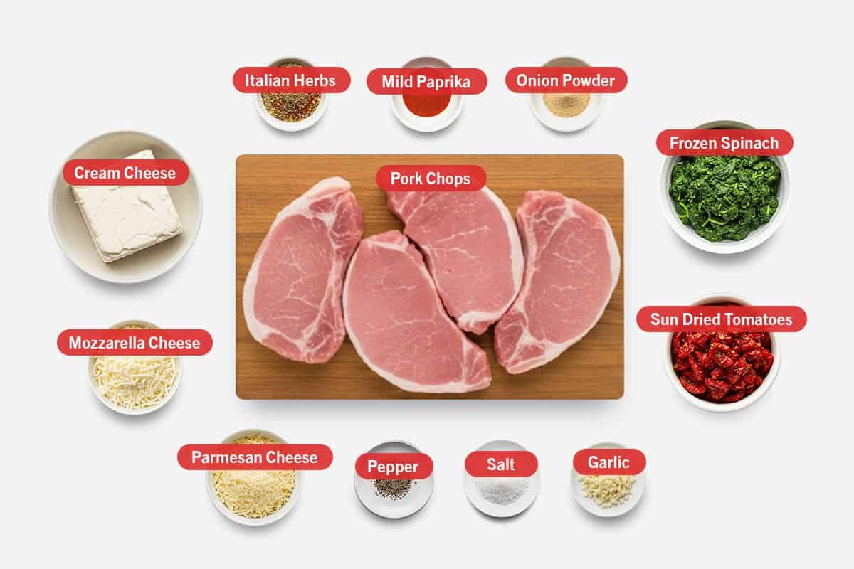 Top shot of ingredients: Cream cheese, italian herbs, mild paprika, onion powder, frozen spinach, sun dried tomatoes, mozzarella cheese, parmesan cheese, pepper, salt, garlic, and pork chops.