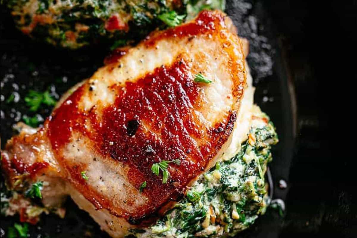 Close-up shot of Creamed Spinach Stuffed Pork Chops.