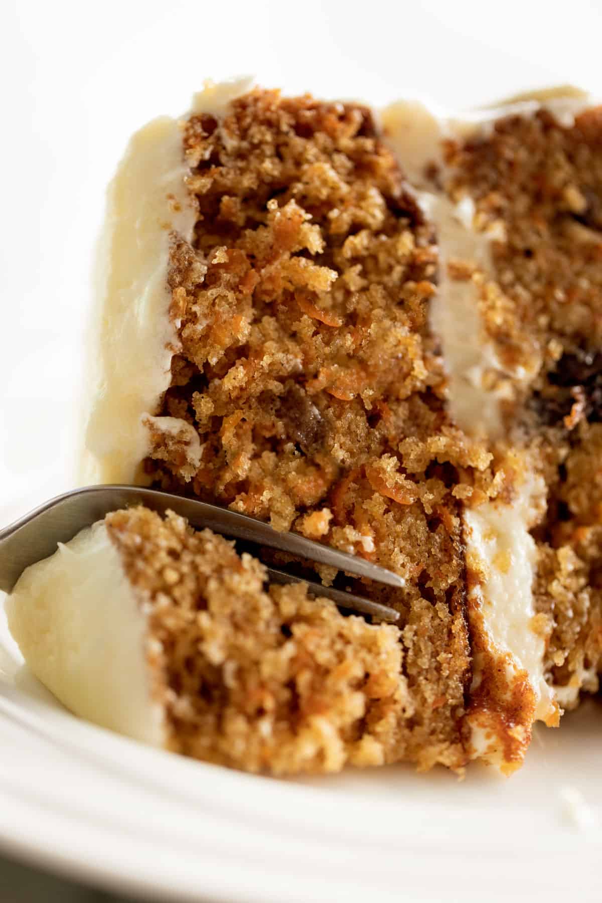 A slice of carrot cake with a fork | cafedelites.com