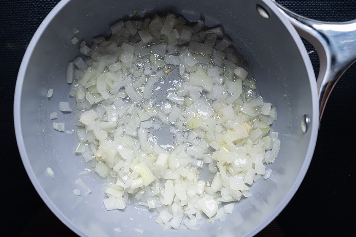 onion being Sauted in a pan
