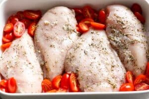 Seasoned chicken in a bed of tomatoes