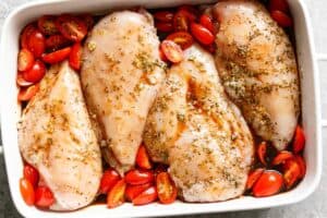 Chicken covered into the balsamic glaze before cooking