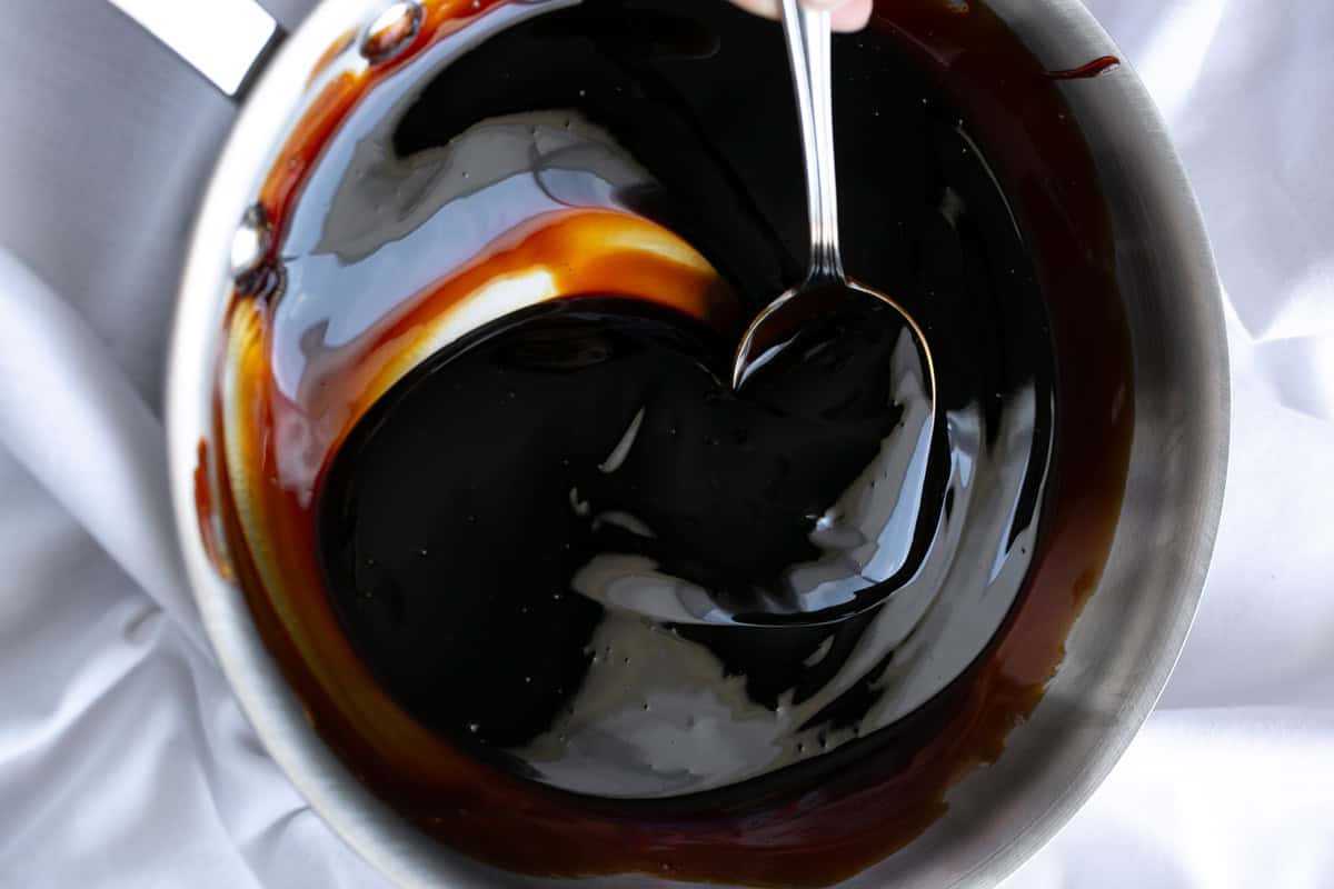 Balsamic glaze being mixed in a bowl