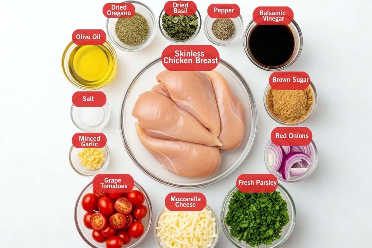Flat lay photo of the ingredients for Balsamic Chicken that contains, dried oregano, dried basil, pepper, balsamic vinegar, brown sugar, sliced red onions, fresh parsley, mozzarella cheese, grape tomatoes, minced garlic, salt, olive oil