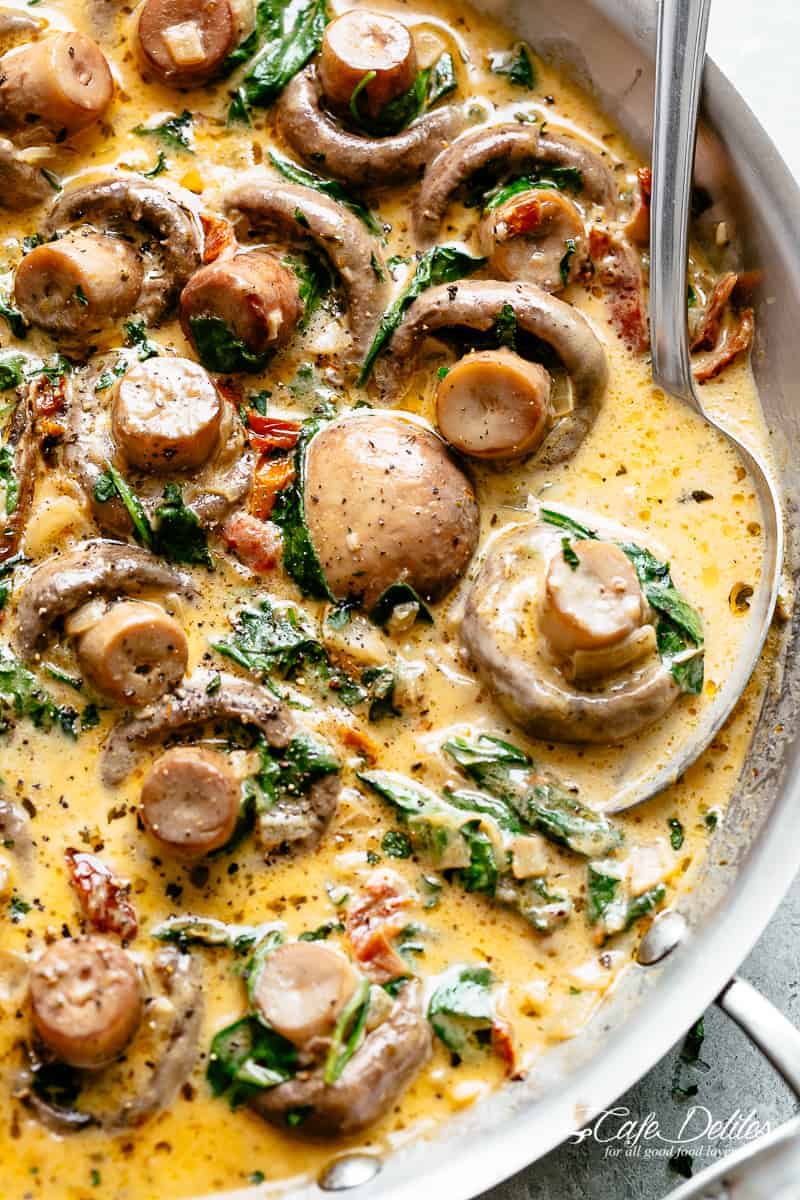Creamy Garlic Butter Tuscan Mushrooms in a rich sauce filled with garlic, sun dried tomatoes, parmesan cheese and spinach. KETO and LOW CARB! | cafedelites.com