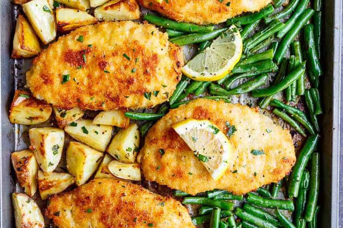 Close-up shot of Crispy Parmesan Baked Chicken Milanese & Veggies.