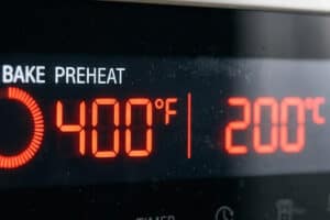Preheating the oven to the right temperature is key to making perfect garlic parmesan roasted carrots