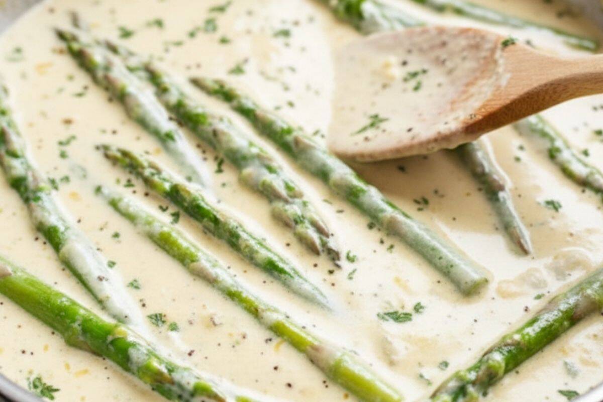 Stir in asparagus and simmer gently.