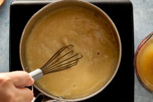 Gravy thickening in saucepan while whisking