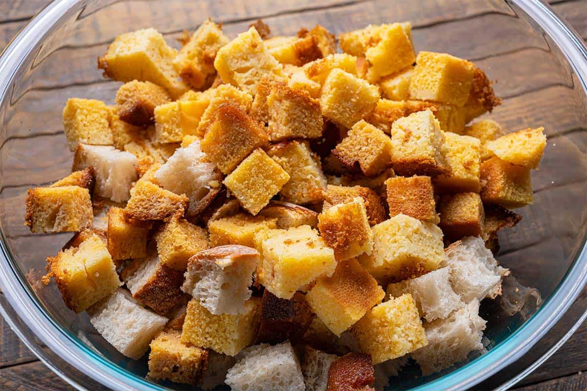 cut up cornbread in a clear bowl