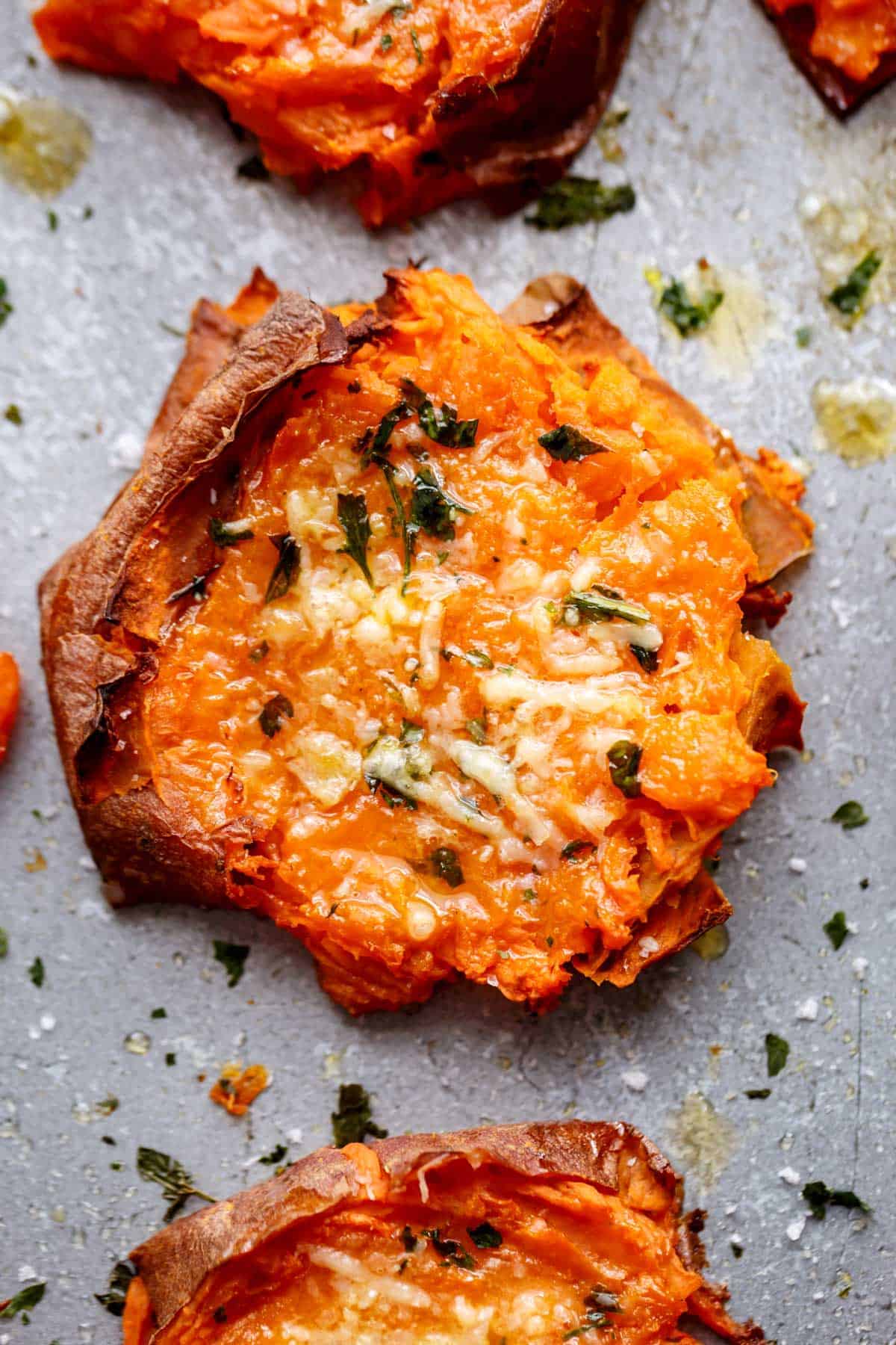 Garlic Butter Smashed Sweet Potatoes With Parmesan | http://cafedelites.com