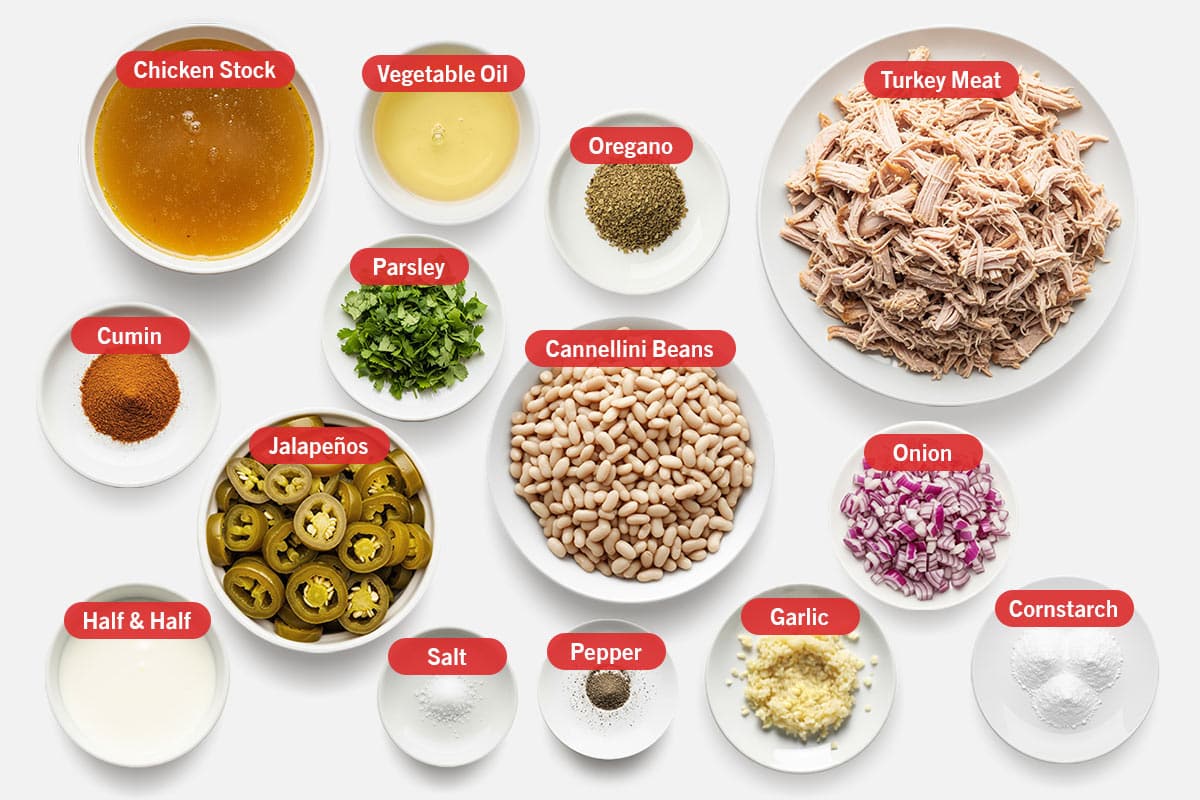 Top shot of ingredients: Chicken stock, vegetable oil, oregano, turkey meat, cumin, parsley, cannellini beans, onion, milk, Jalapeños, salt, pepper, garlic, and cornstarch.