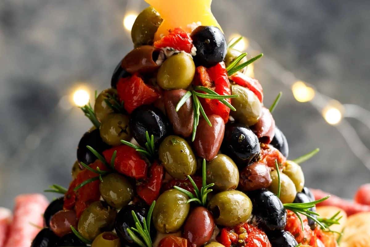 Cut a star from yellow or orange bell pepper or use a thick slice of cheese and set it on top. Serve with crackers, rolled salami, and prosciutto.