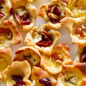 A plate full of the crisp baked brie bites.