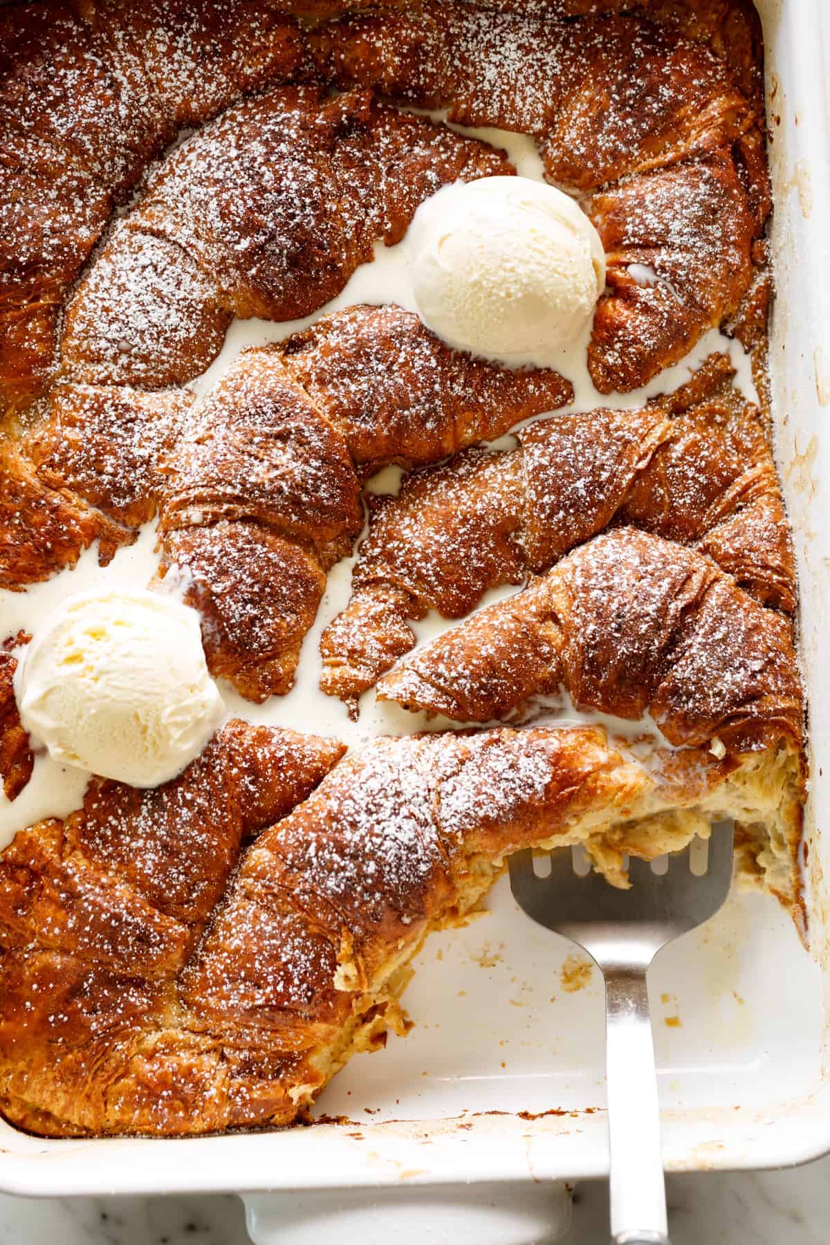 Croissant French Toast in a baking dish oven baked | cafedelites.com