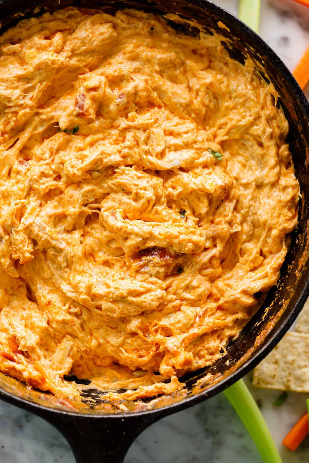 buffalo chicken dip in a cast iron skillet | cafedelites.com
