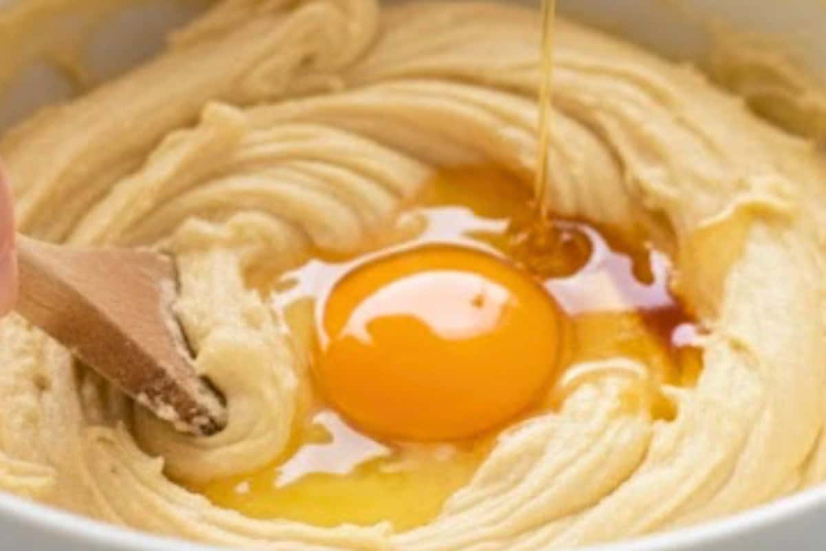 Mix in the syrup, vanilla extract, and egg, and beat lightly until everything is just combined.