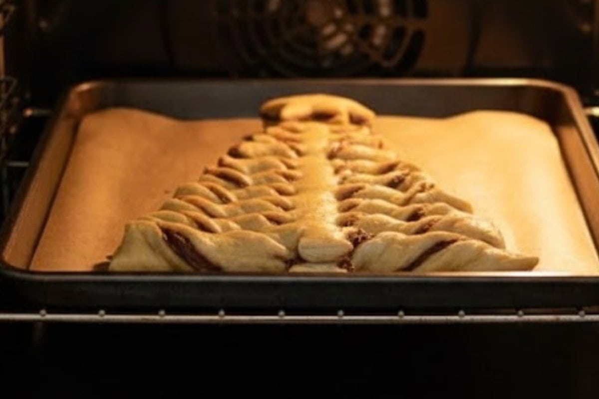 Whisk the egg yolk with a little water, and brush this mixture all over the puff pastry tree. Pop it in the oven and bake for about 25-30 minutes