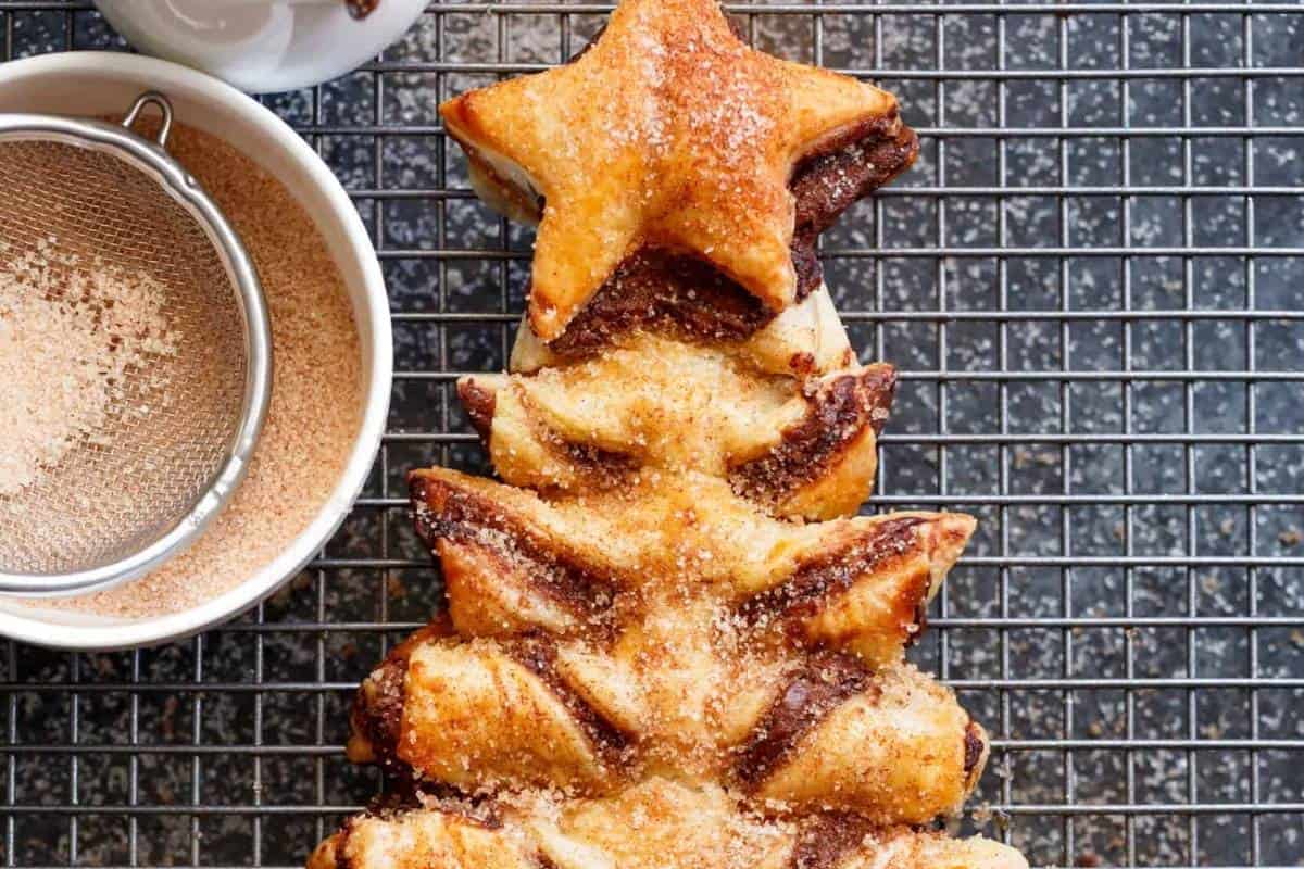 Let it cool down and brush with melted butter and sprinkle the cinnamon sugar over it generously.