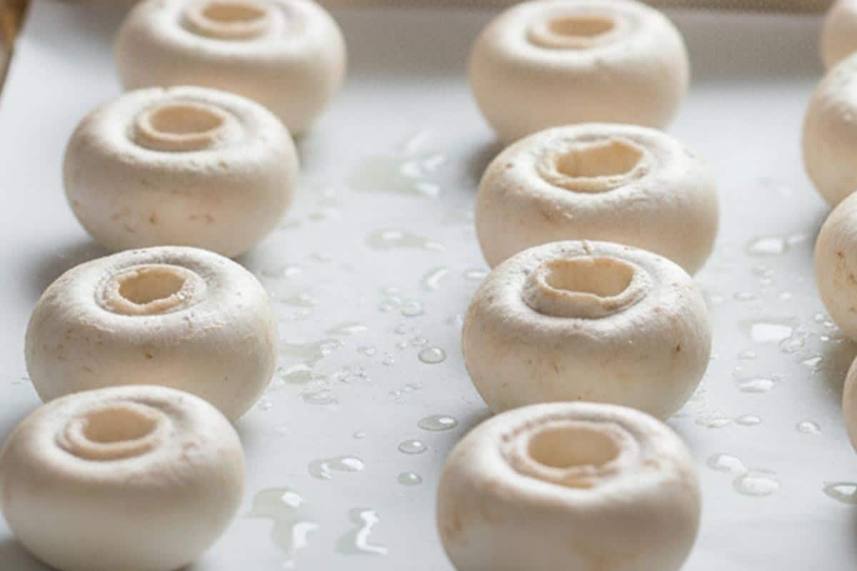 lightly sprayed mushrooms on a baking sheet.