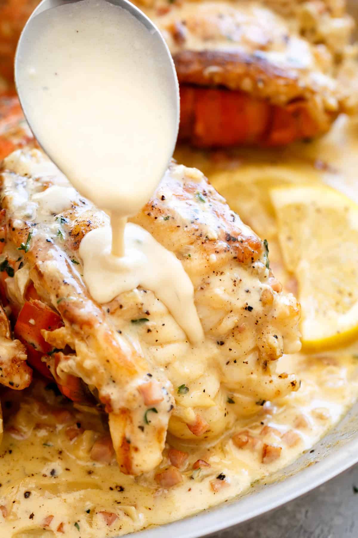 Lobster tails served with a creamy garlic sauce | cafedelites.com