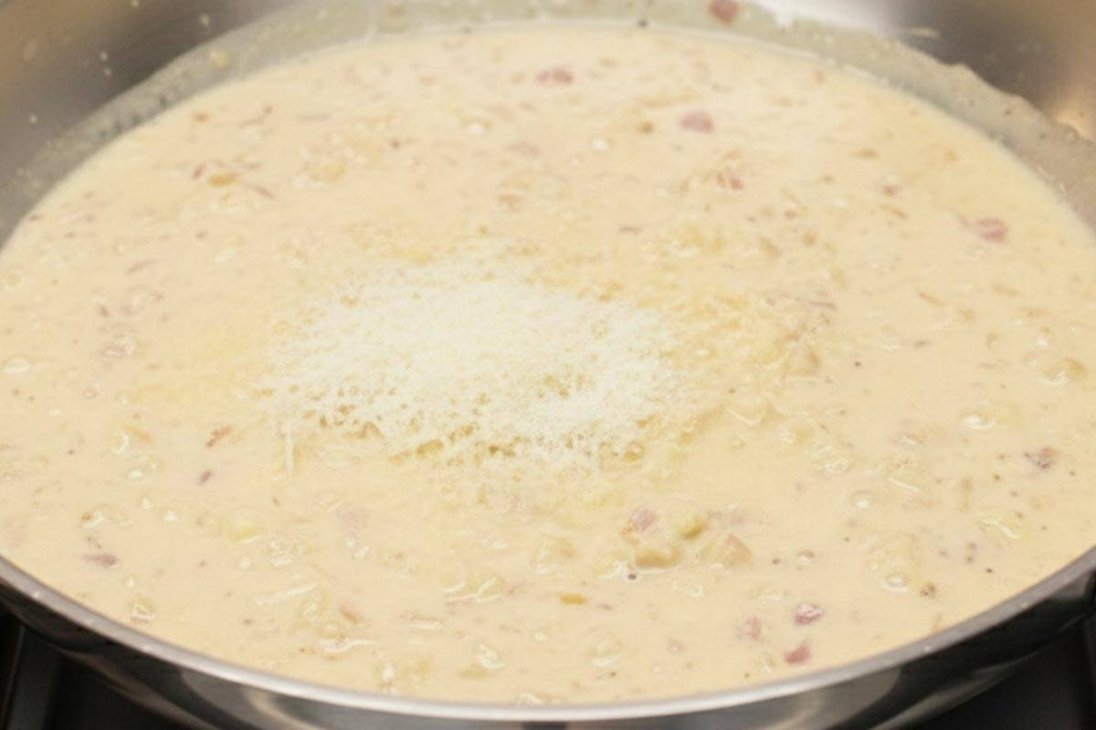 Making the garlic cream sauce in the skillet. - 8