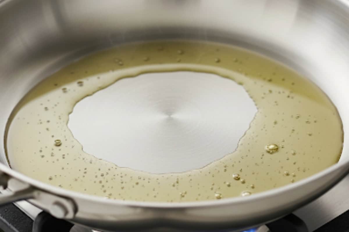 Heat a large skillet over medium-high until hot and sizzling. Add a thin film of olive oil and swirl to coat the surface evenly.