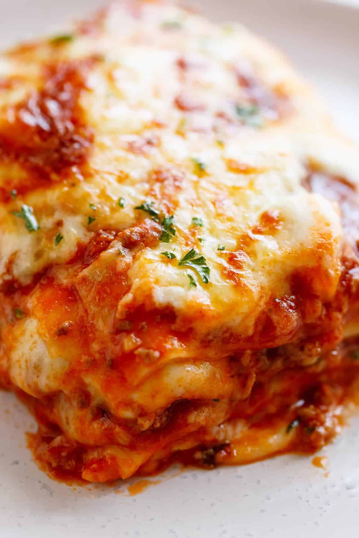 Image of lasagna being served on a plate.
