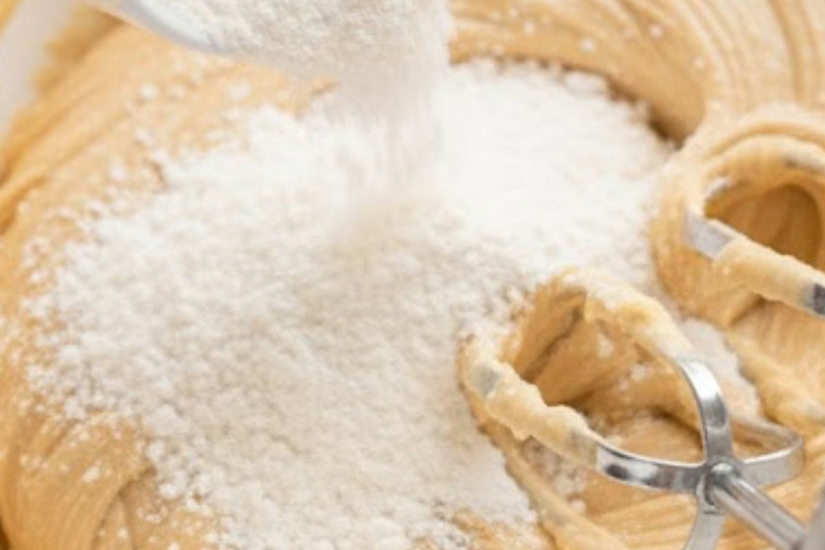 Gradually add the dry mixture to the wet ingredients in ½ cup increments until the dough forms.