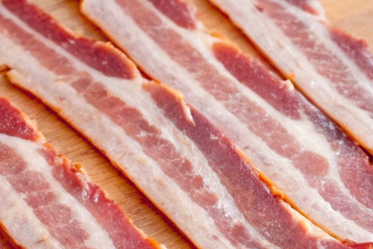 Slice each bacon strip in half lengthwise.