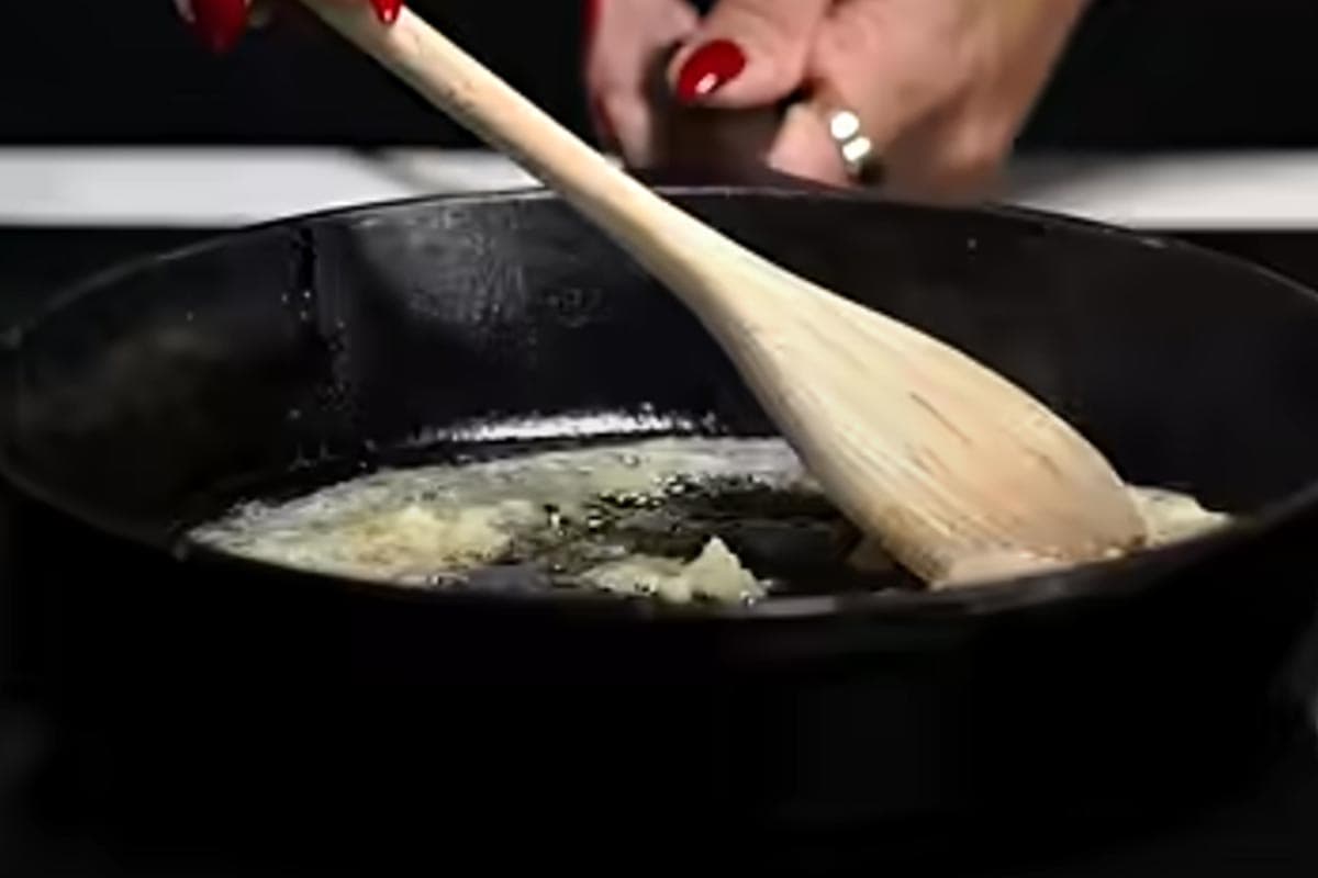 Cooking the garlic in the pan.