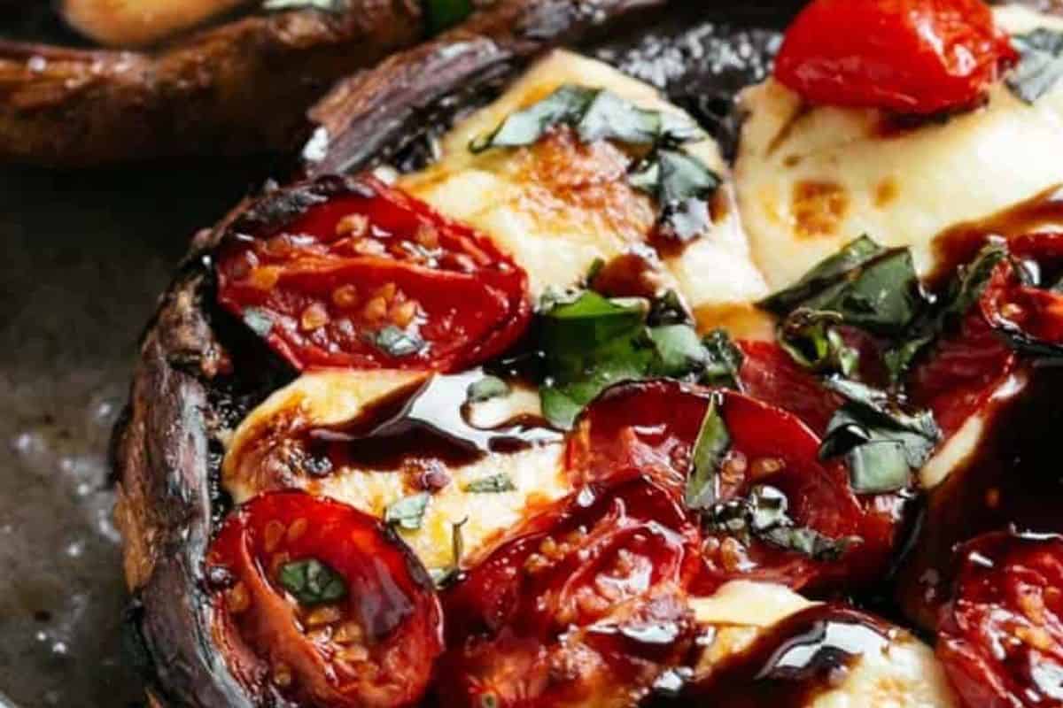 Top with fresh basil, drizzle with balsamic glaze, season with salt to taste, and serve immediately while warm.