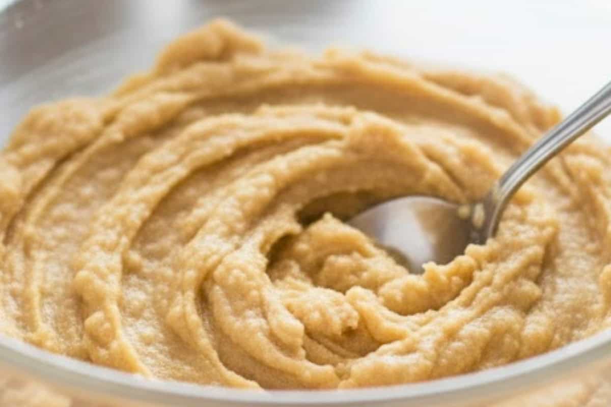 Peel and mash the bananas in a shallow bowl until smooth and creamy.