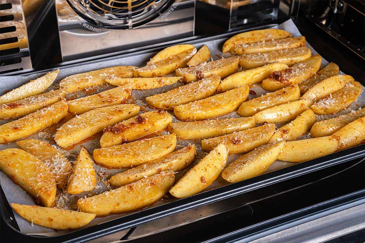 Image of wedges being baked in the oven for about 35 minutes.