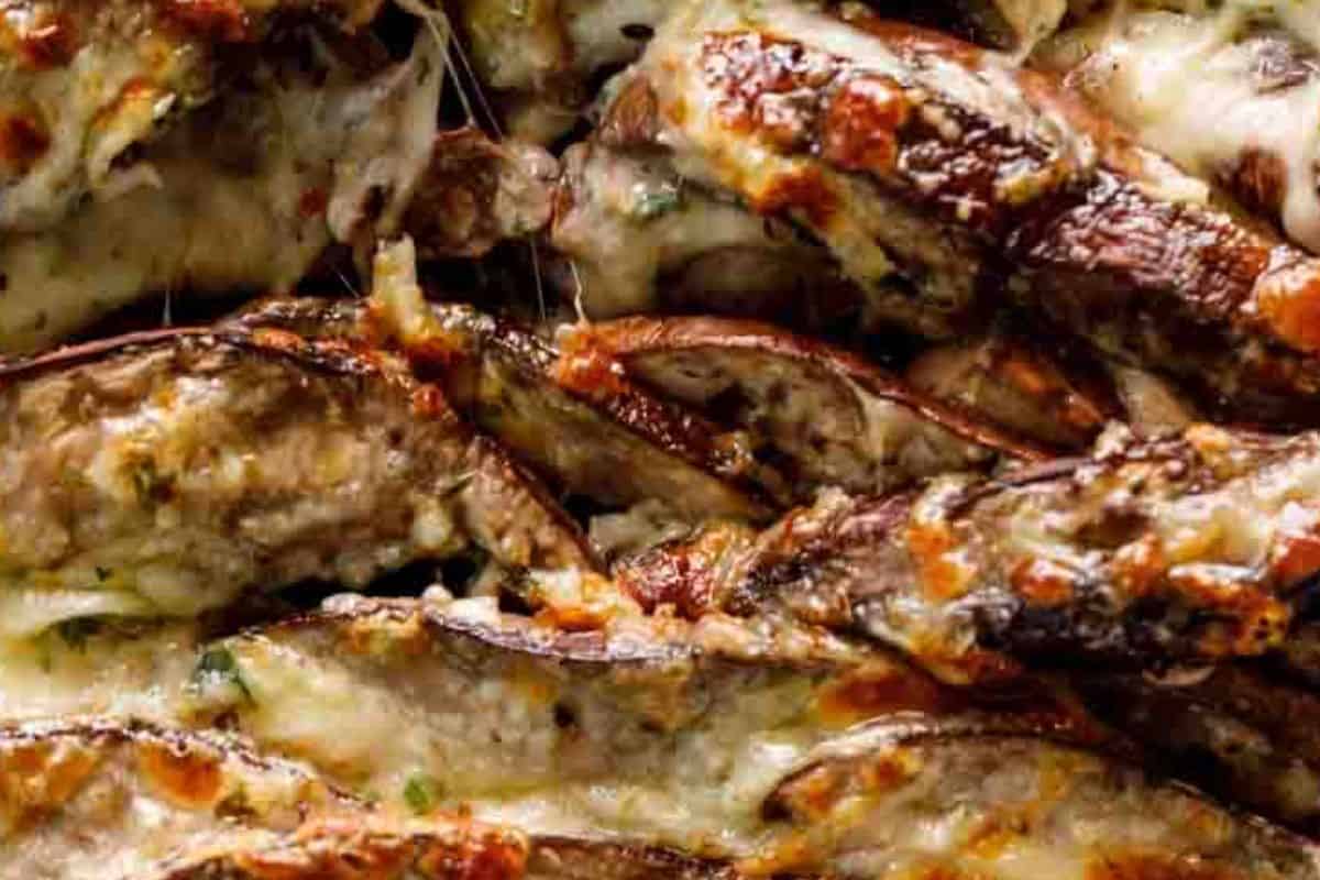 Return the mushrooms to the oven and broil for 4–5 minutes until the cheese topping is golden
