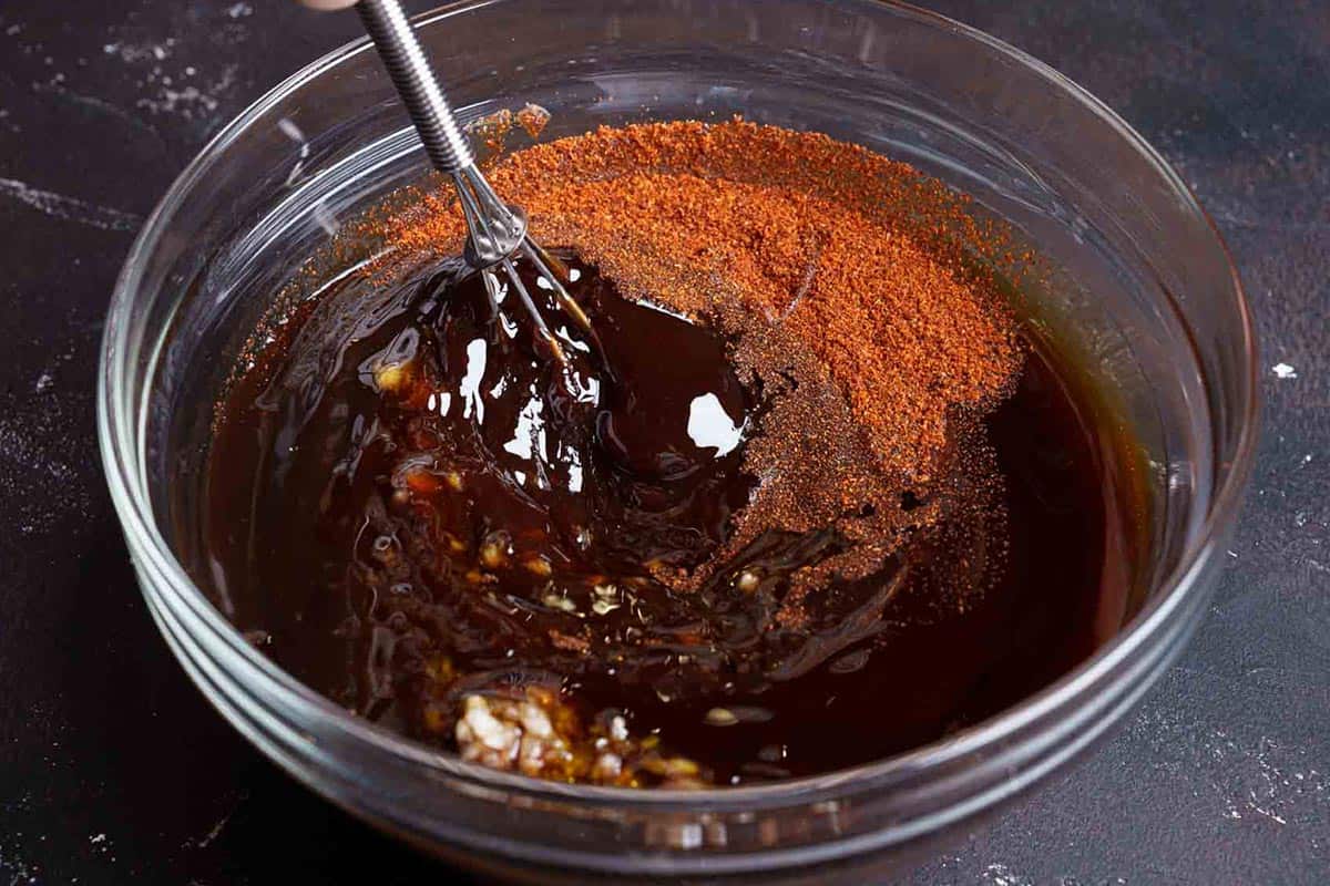 Image of the marinade ingredients being mixed together before being applied to the ribs.