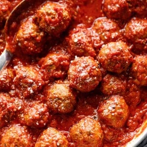 Easy Baked Meatballs in a pan with tomato sauce