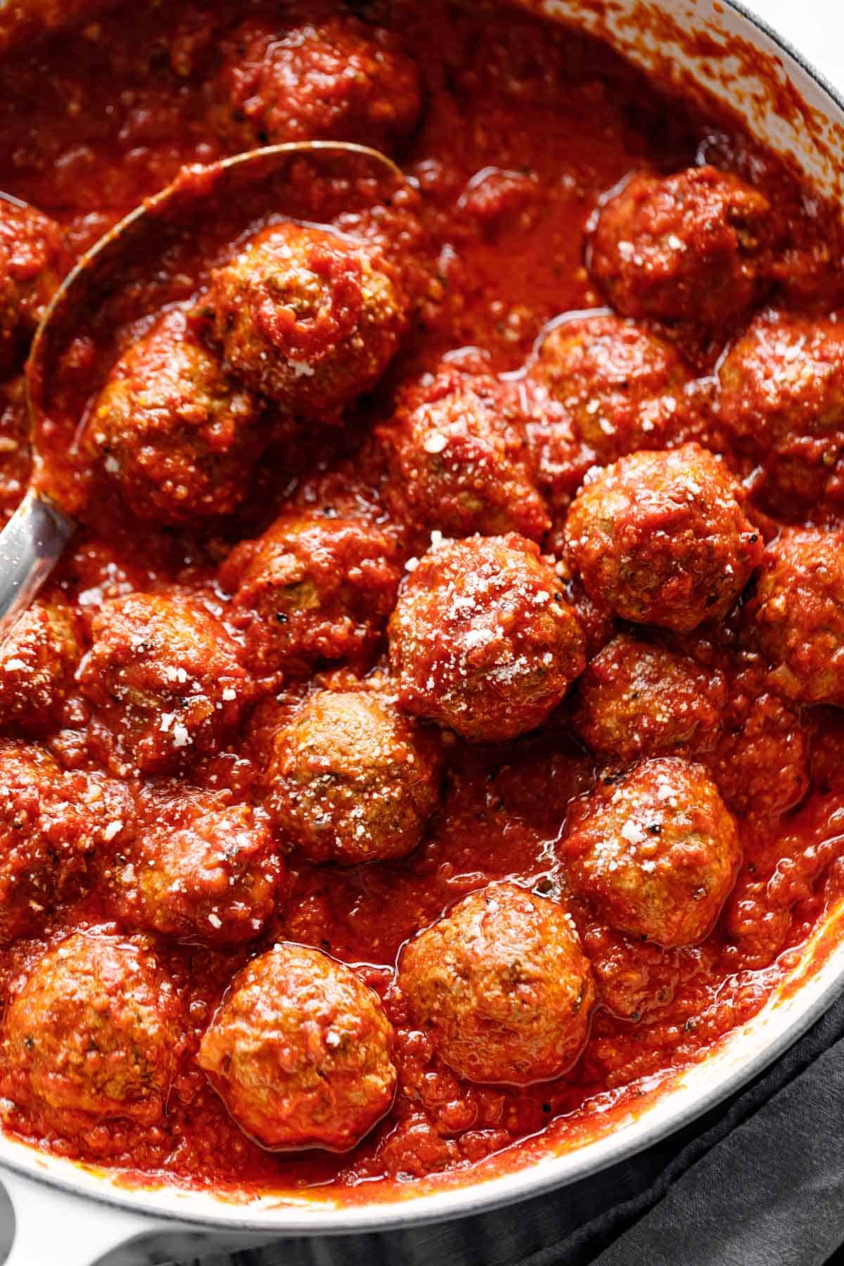 Easy Baked Meatballs in a pan with tomato sauce | cafedelites.com