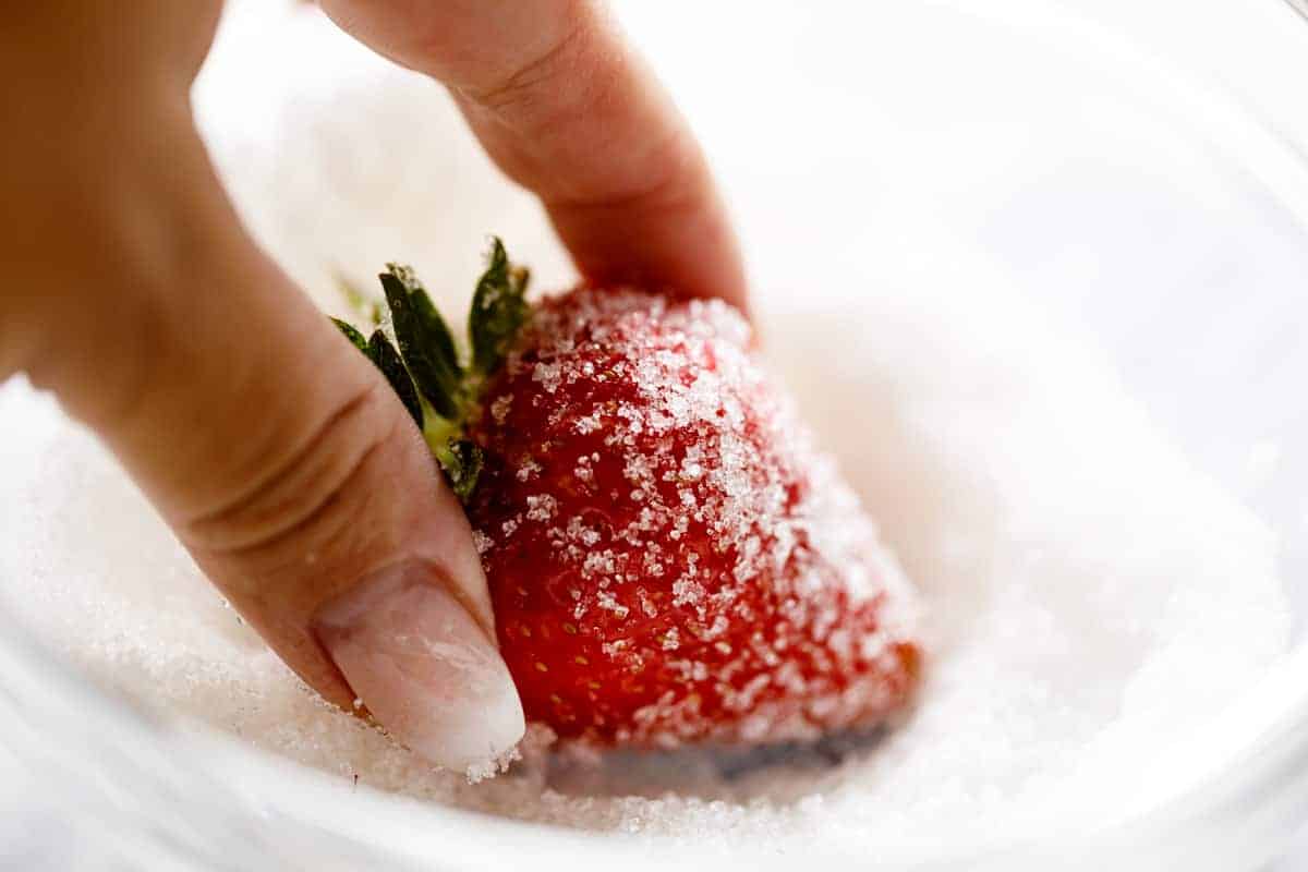 coating strawberries in sugar